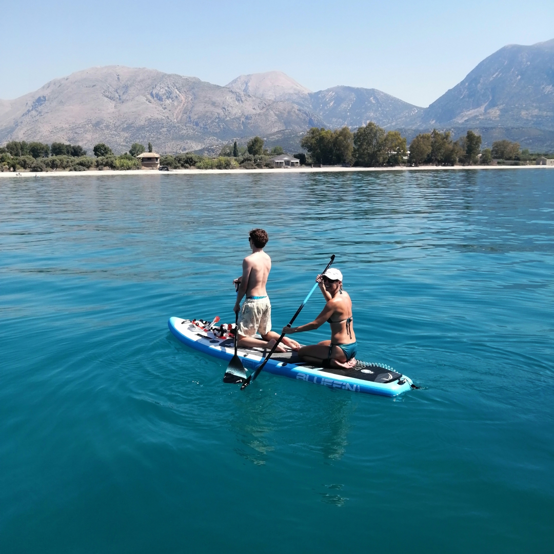 Standup Paddleboarding from our catamaran in Greece.